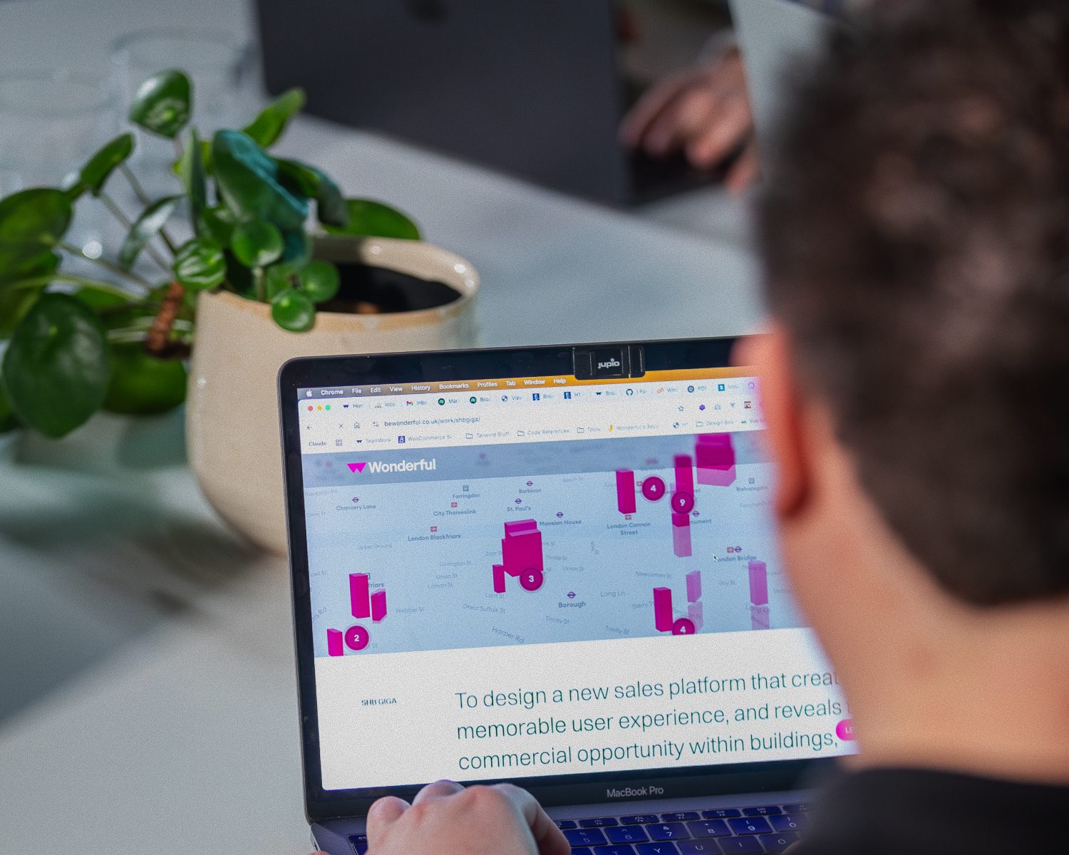 A Wonderful designer reviewing a client sales platform